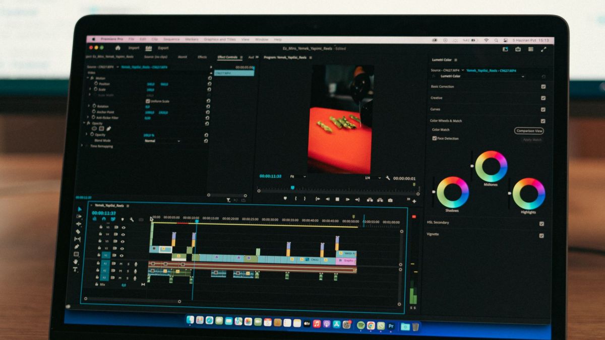 Close-up of video editing software on a laptop screen in a professional setting.