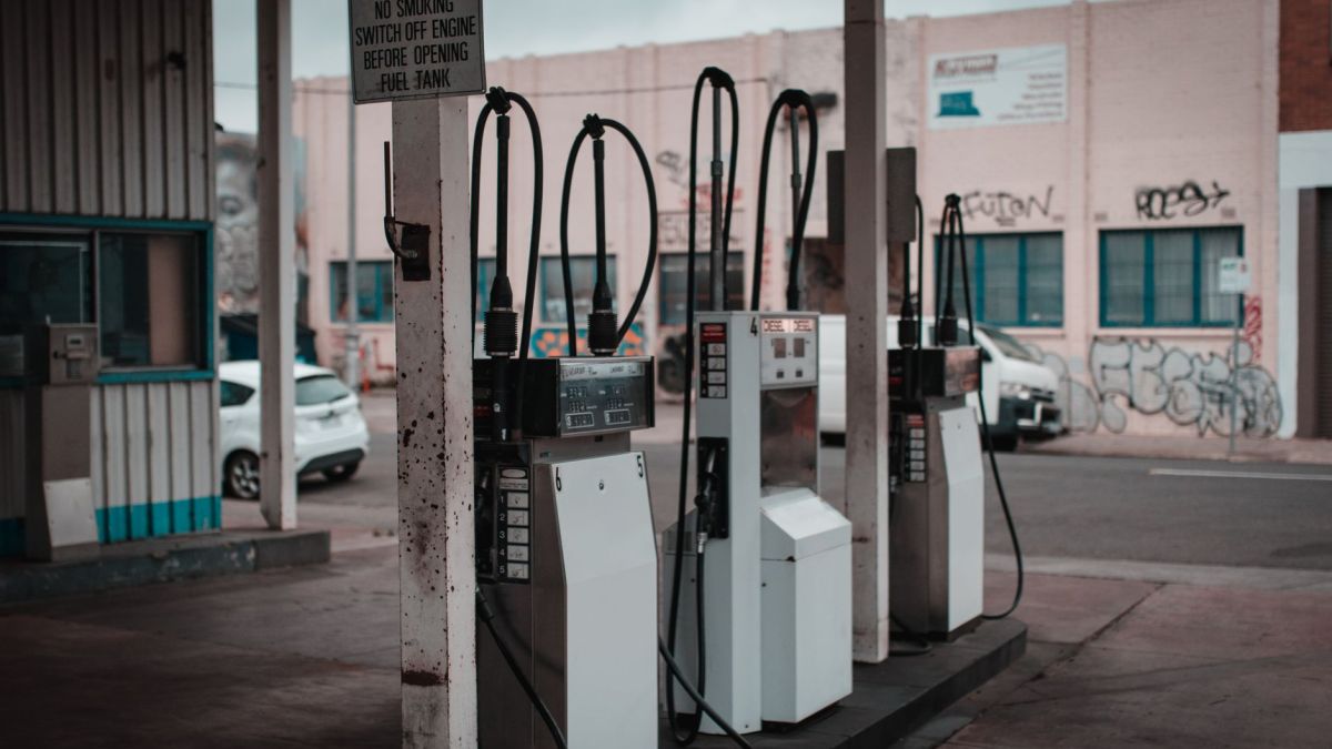 Empty gas station with visible graffiti in Collingwood, Australia.
