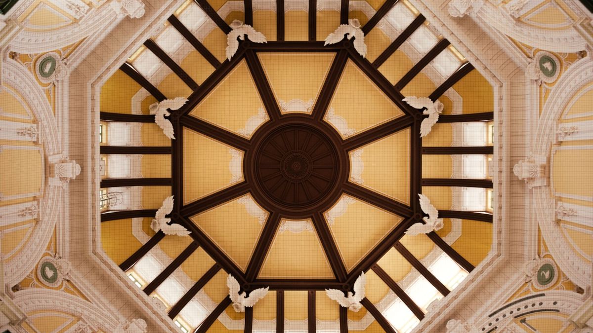 A detailed view of the octagonal wooden ceiling in Tokyo Station, Japan.