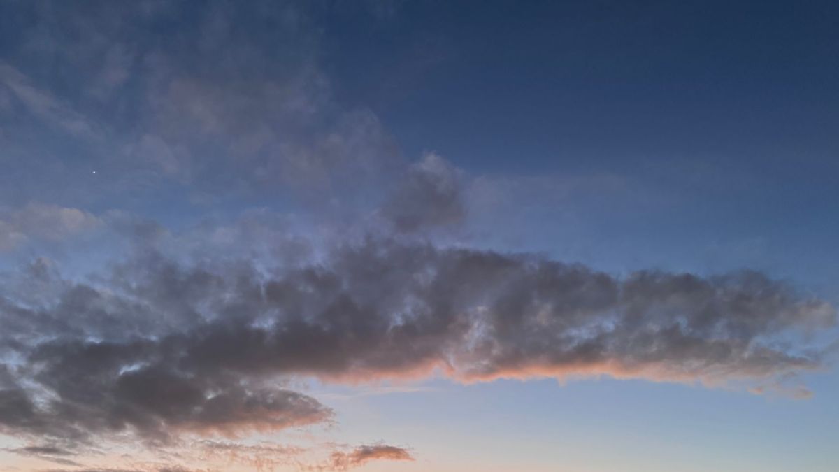 Beautiful winter sunset with dramatic clouds and vibrant colors in the sky.