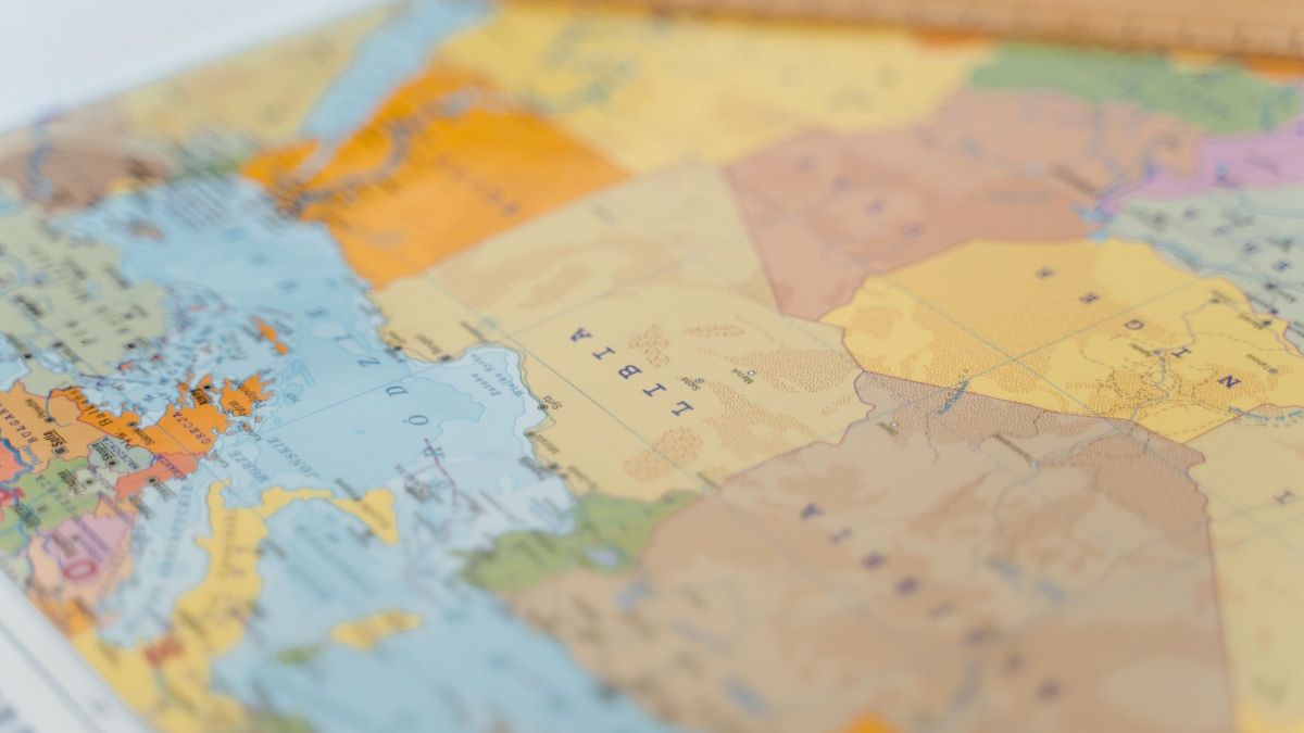 Colorful world map close-up showing African countries with focus on Libya and surrounding areas.