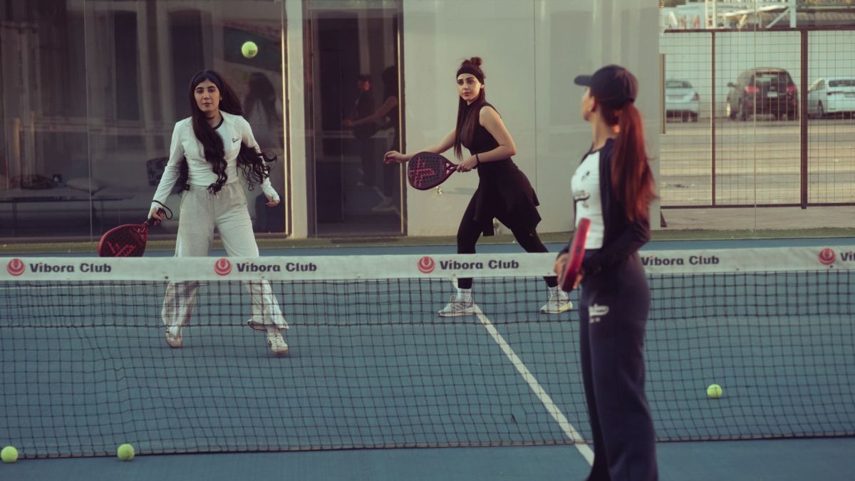Women engaged in a padel tennis match at Vibora Club, Baghdad, Iraq.