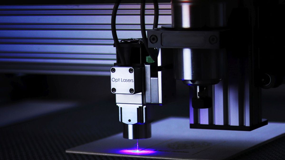 Close-up of cutting-edge laser engraving machine in a precision manufacturing process.