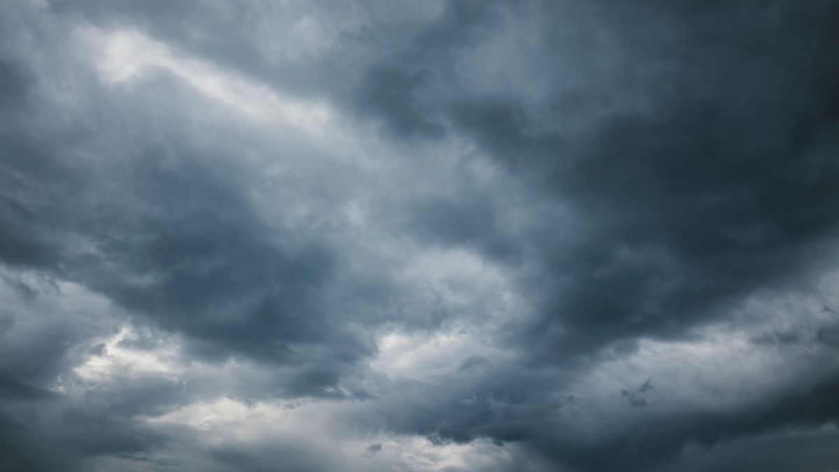 Moody sky with thick storm clouds, capturing the essence of an approaching storm.