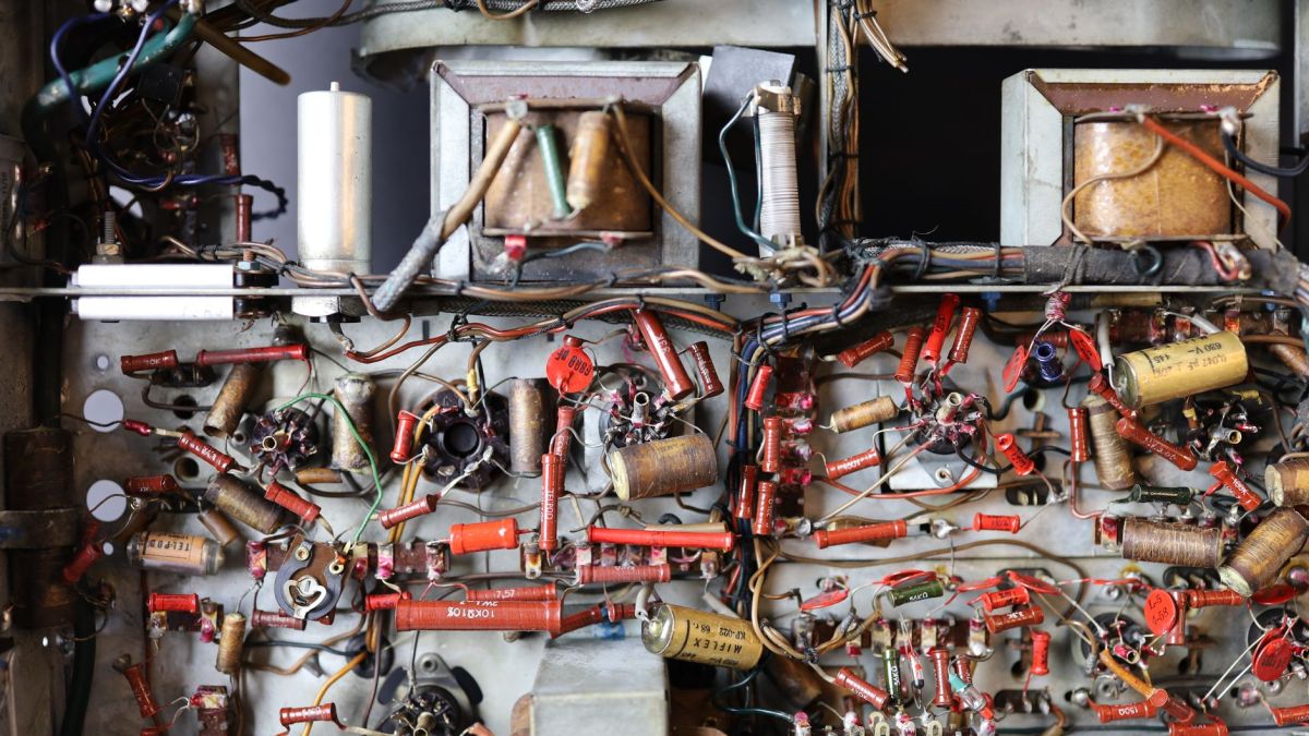 Detailed view of a retro electronics board with wires and components.