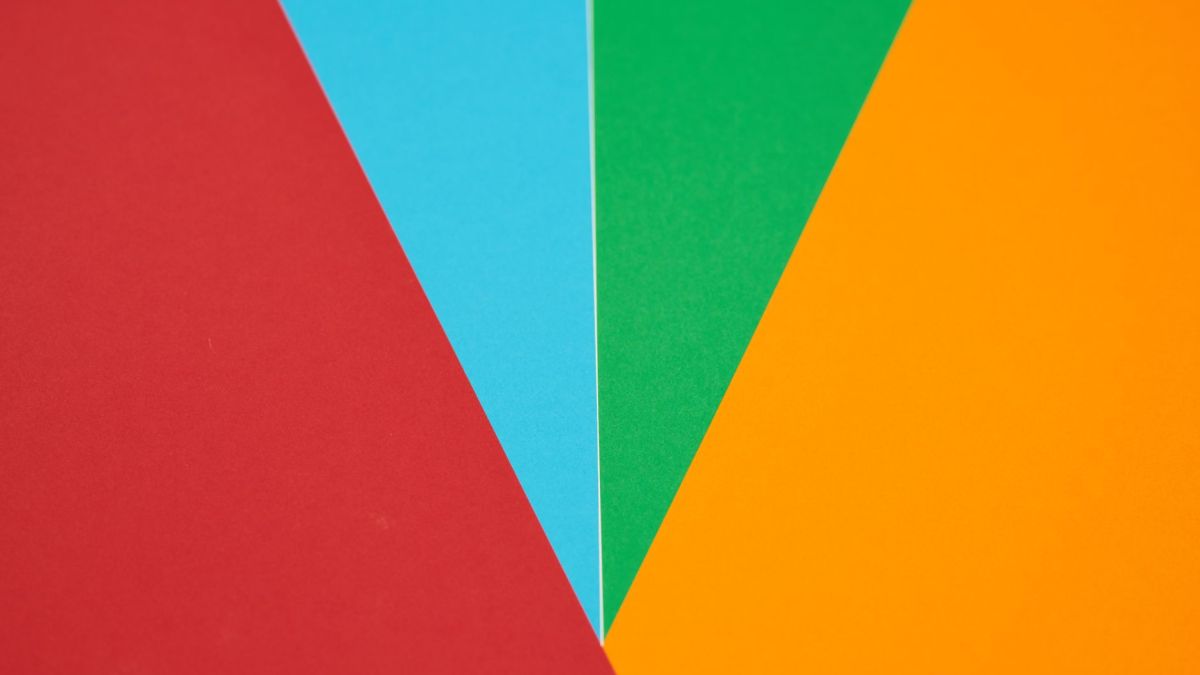 Colorful abstract design featuring red, blue, green, and orange geometric shapes.