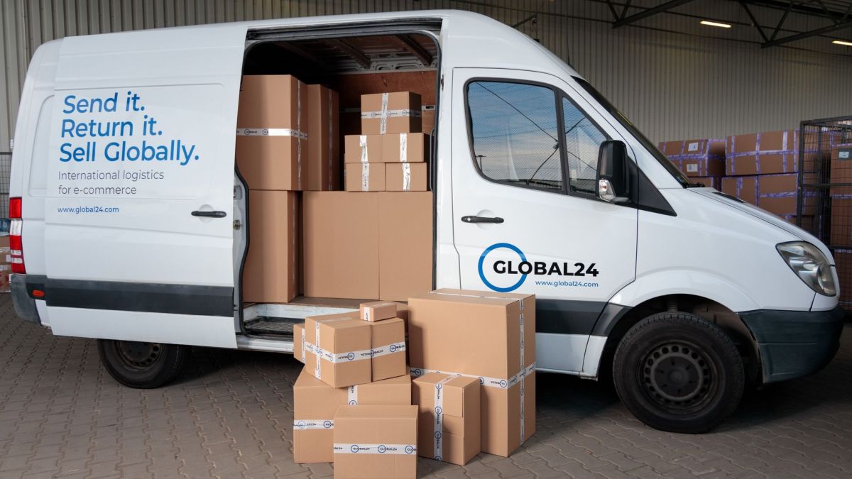 Delivery van loaded with cardboard boxes for global shipping logistics.