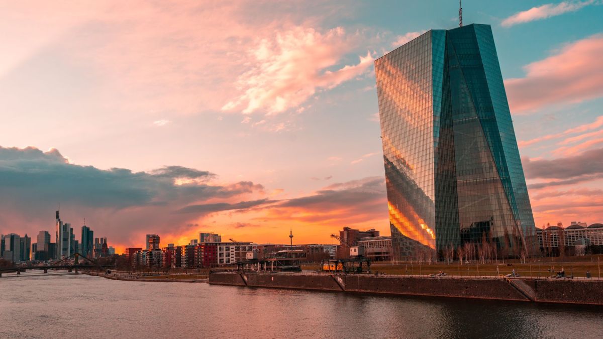 Stunning sunset over Frankfurt's skyline featuring the iconic ECB Tower and Main River.