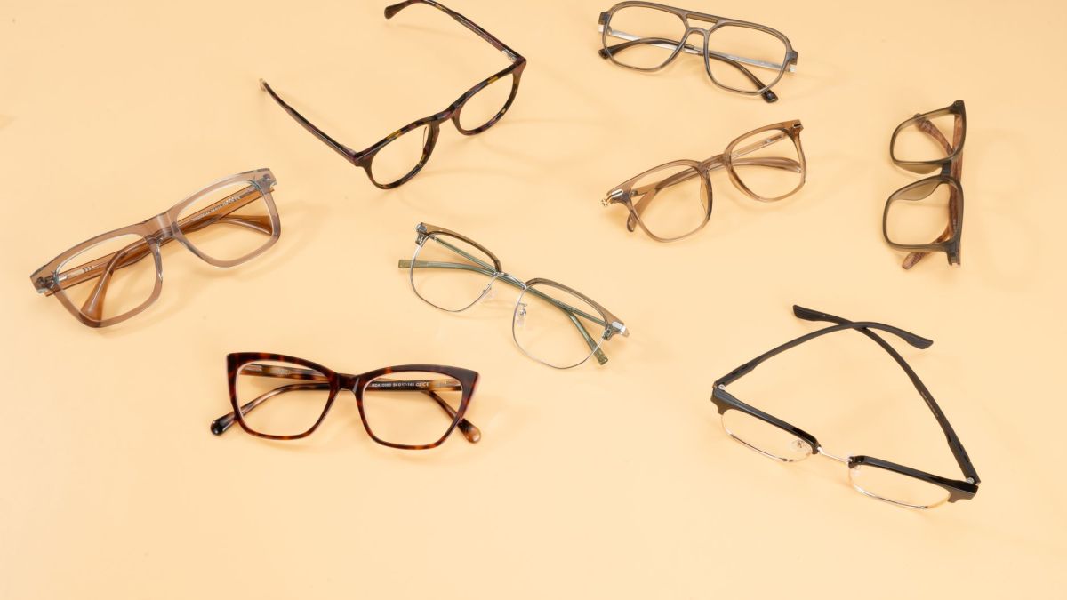 A stylish collection of eyeglasses showcased on a beige background, capturing modern fashion trends.