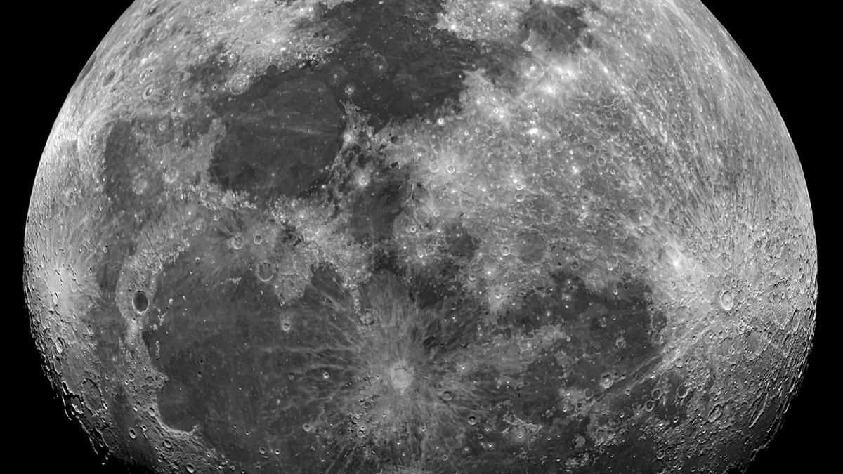 Black and white image of the detailed surface of the moon showing craters and textures.