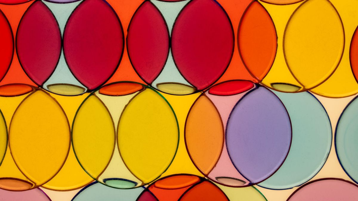 Bright and vibrant overlapping circles creating a modern, geometric art pattern with translucent colors