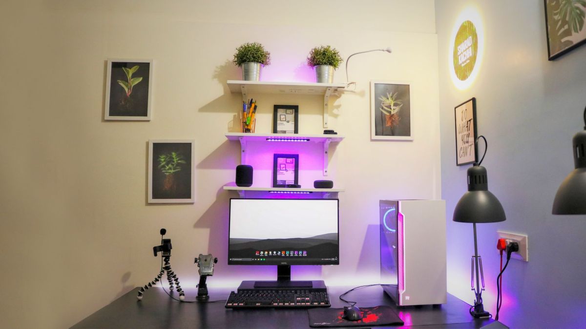 Minimalist home office setup with modern tech, ideal for creative and organized workspaces.