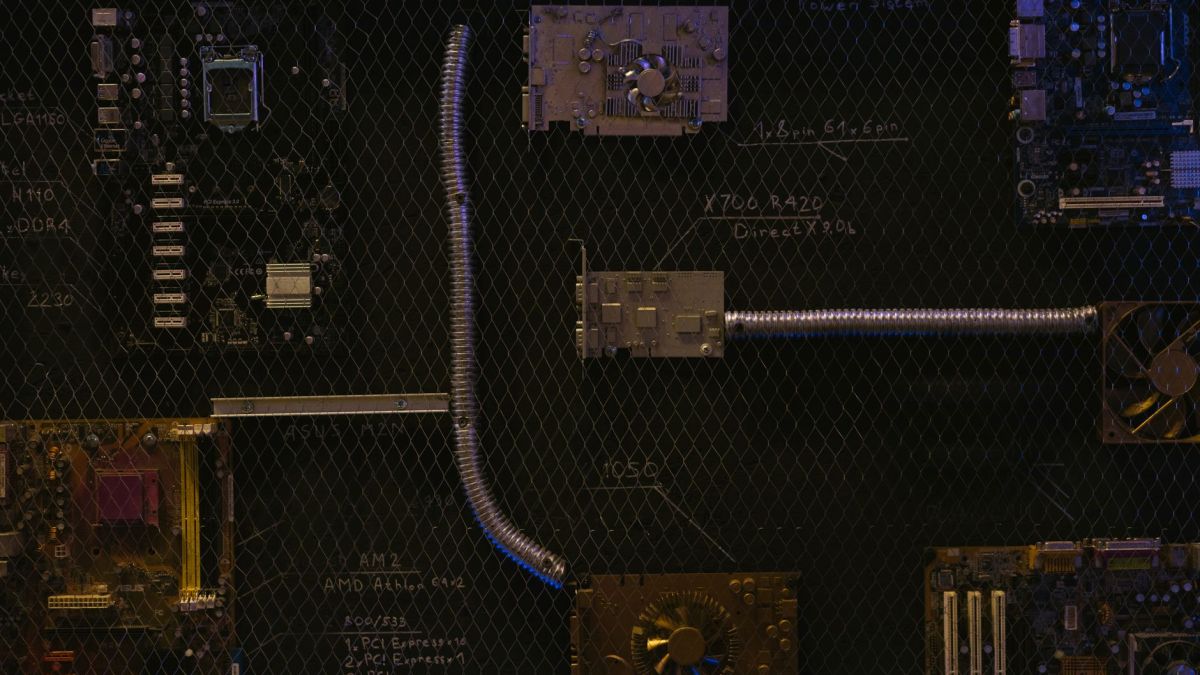 Artistic arrangement of circuit boards and cables symbolizes modern technology.