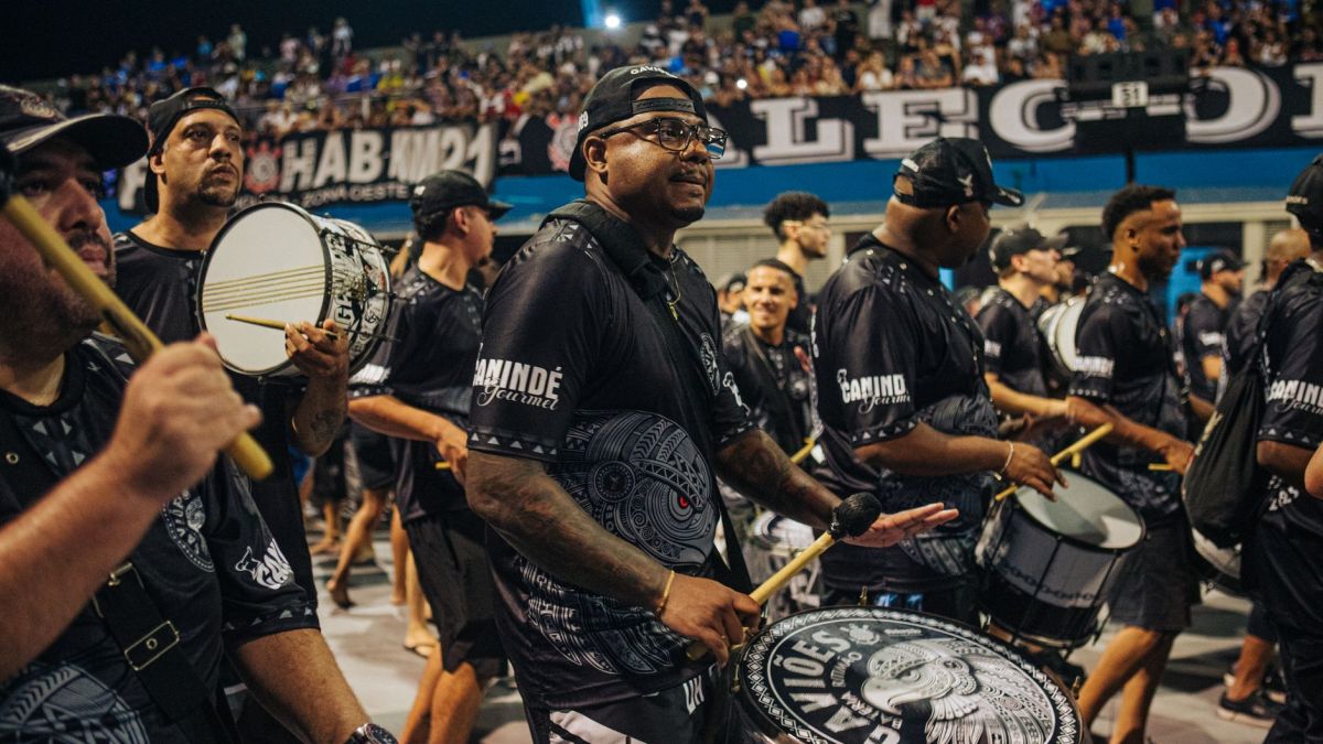 Exciting drum band performance during a vibrant carnival in São Paulo, Brazil, capturing cultural celebration.