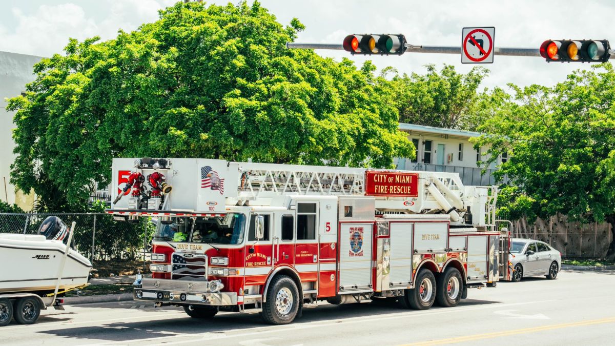 City of Miami fire-rescue truck with dive team module on a sunny street.