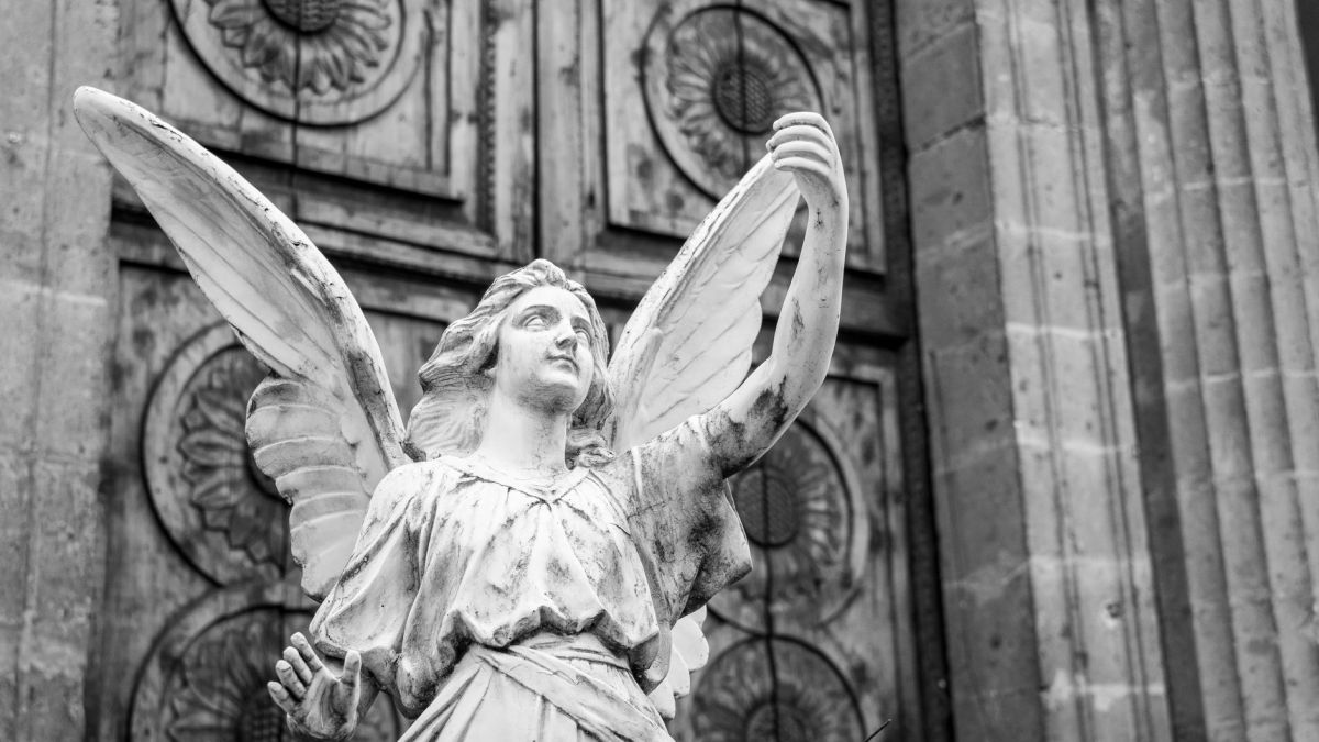 Black and white photo of a majestic angel sculpture in Mexico City.
