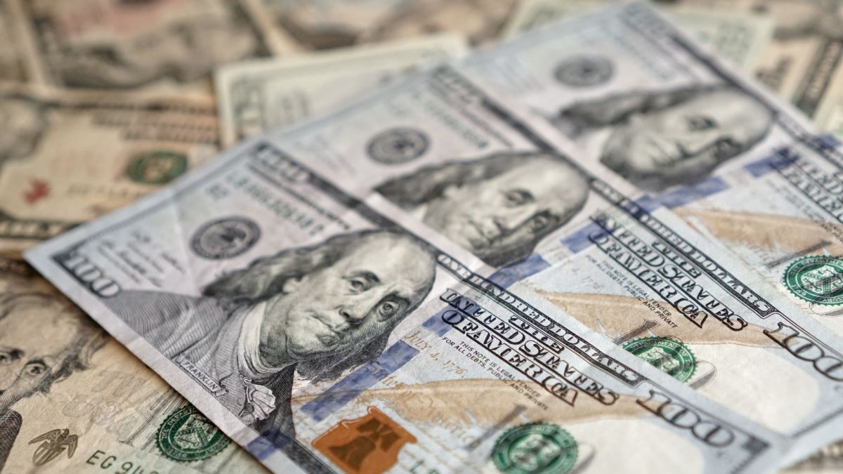 Detailed view of US dollar banknotes showcasing currency and investment themes.