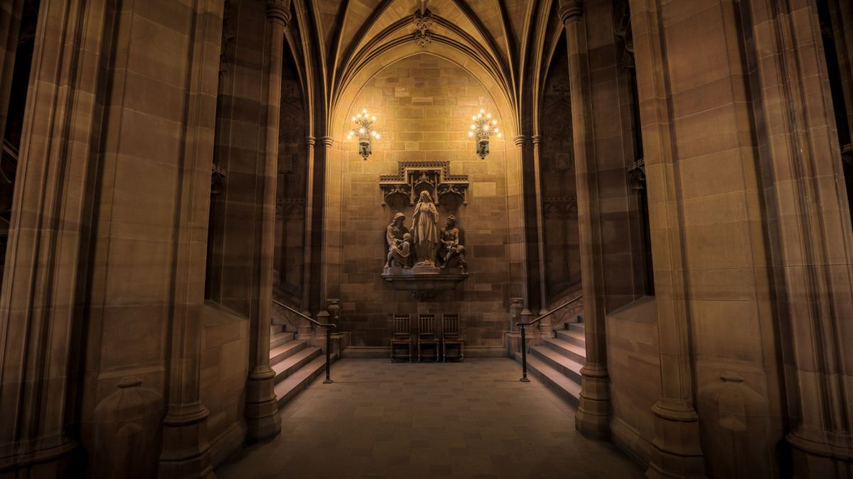 Explore the historic Gothic interior of the John Rylands Library in Manchester.