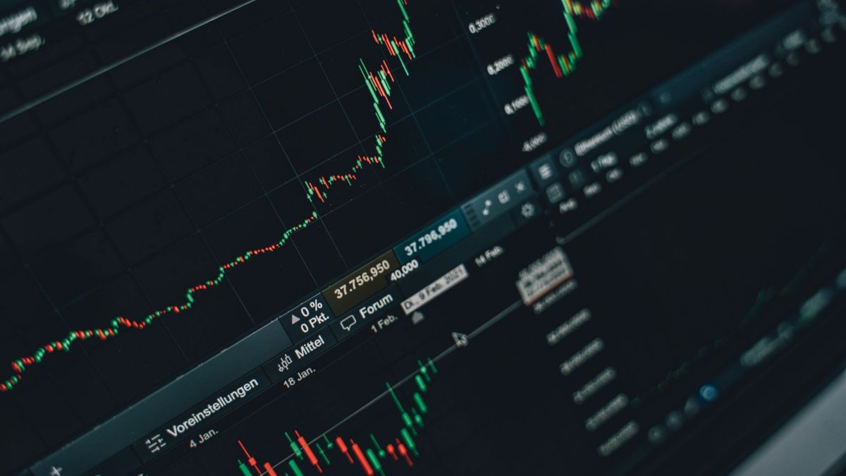 Close-up of stock market trading screen displaying financial growth and charts.