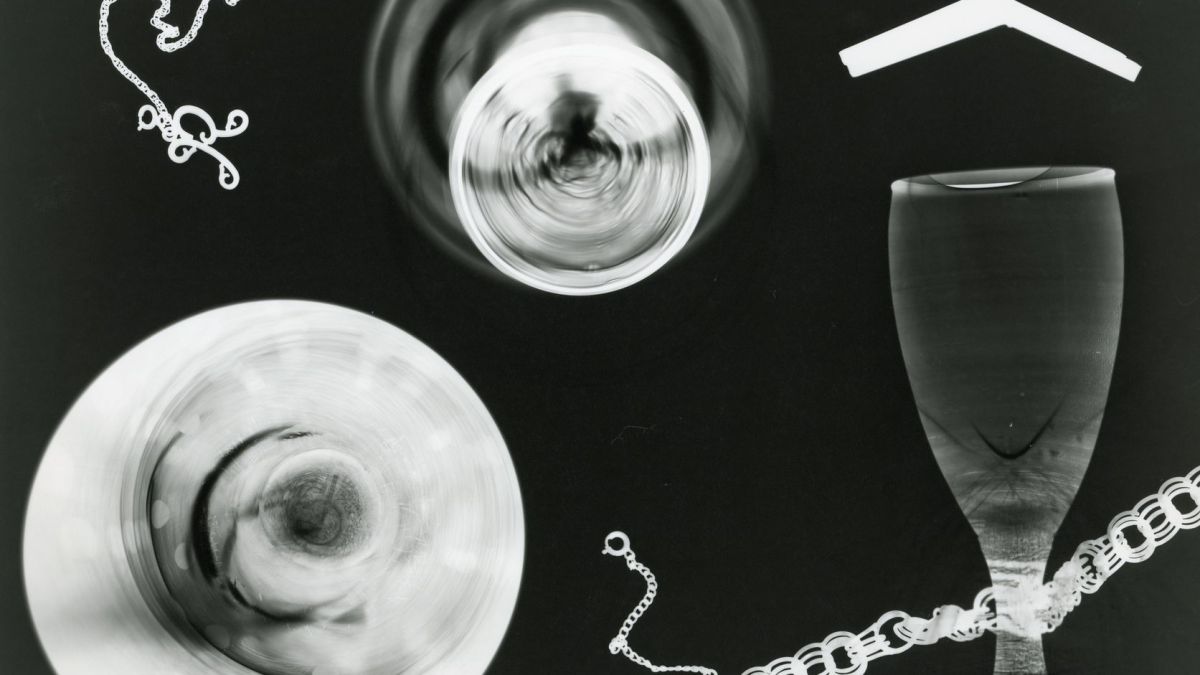 Creative abstract art featuring x-ray imagery of glass objects and chains.