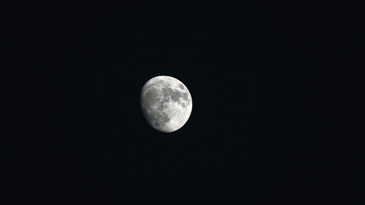High-resolution image of the moon against a deep black night sky, showcasing details and texture.