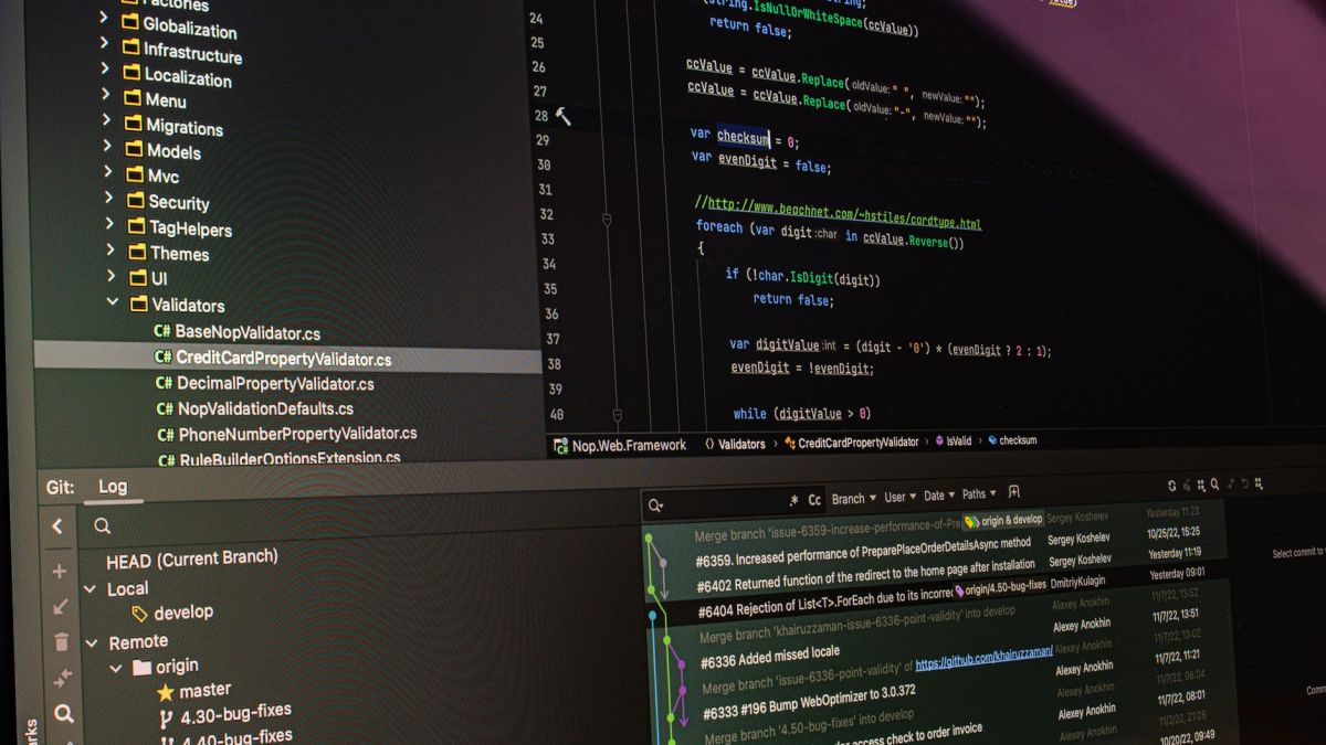 Close-up of software development tools displaying code and version control systems on a computer monitor.